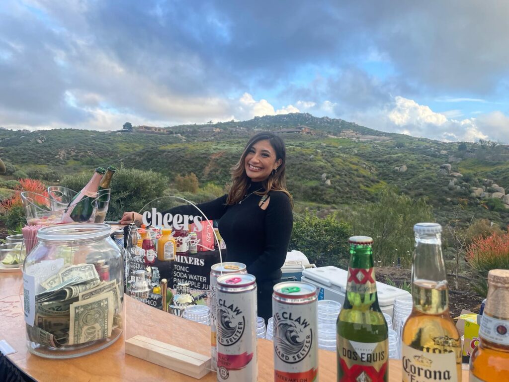 Female bartender serving cocktails